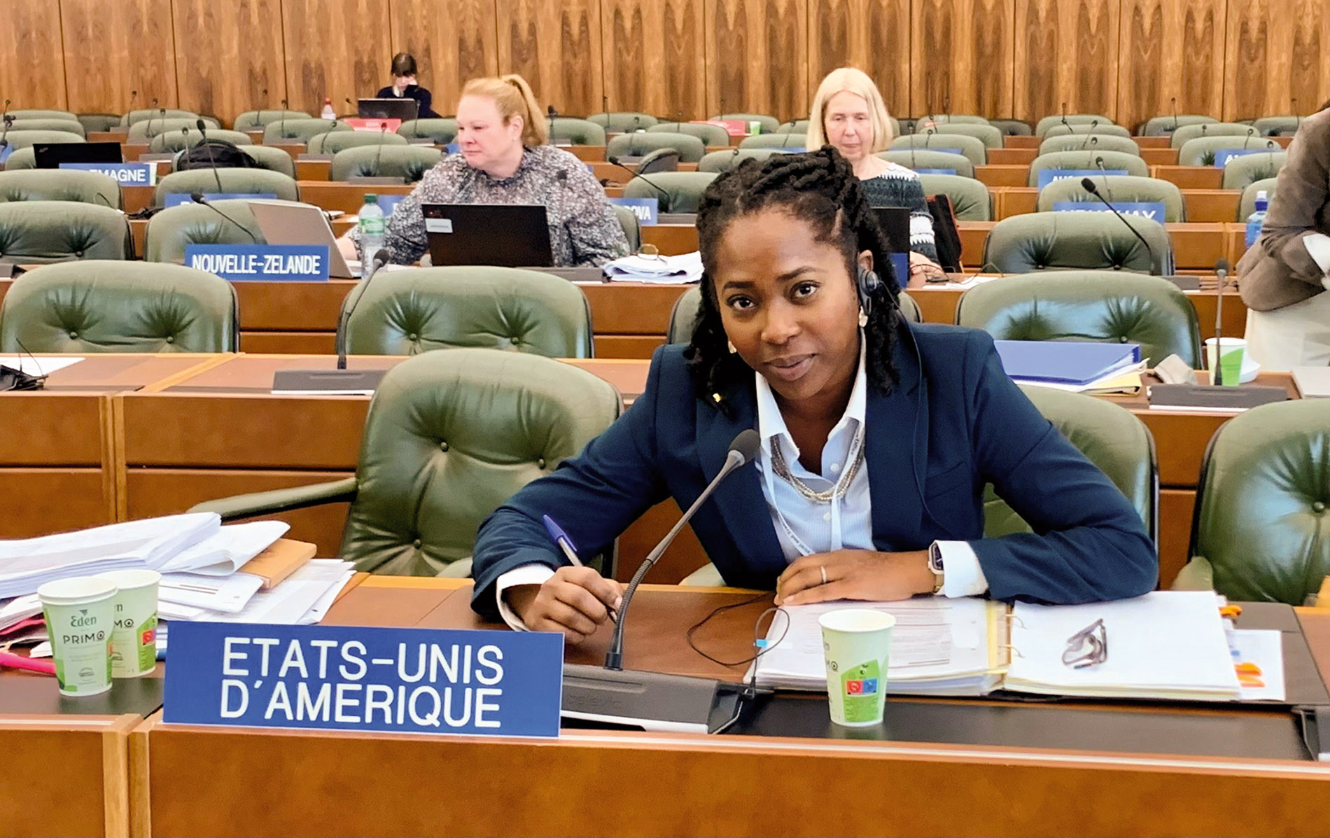 Image of Bernice Howse-Middleton with a nameplate and microphone in front of her