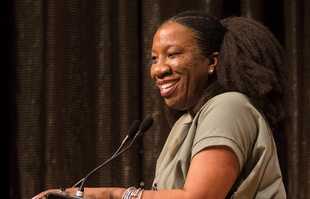 Tarana Burke stands at a podium