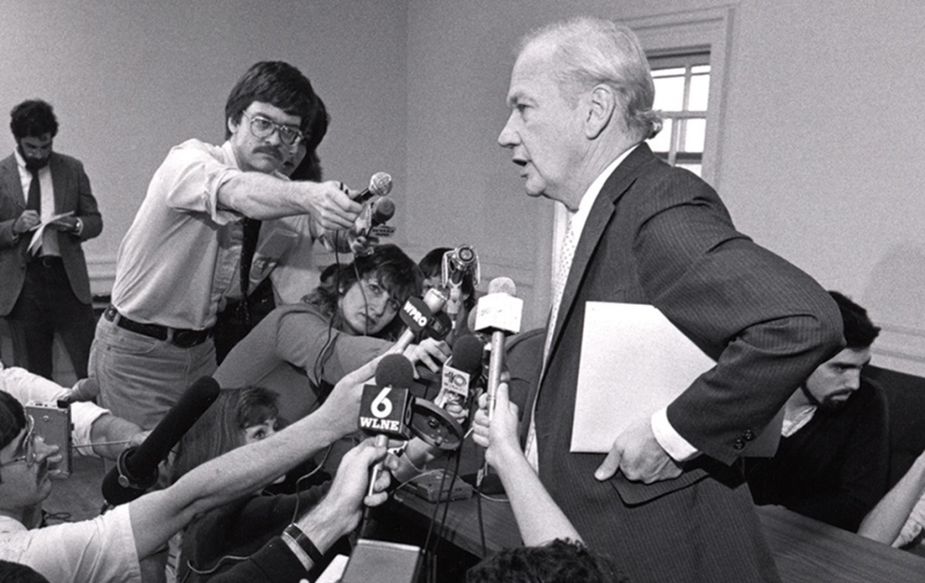 Bob Reichley surrounded by journalists