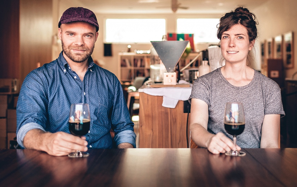 Photograph of Joe Grimm ’06 AM and Lauren (Carter) Grimm ’05 inside their brewery