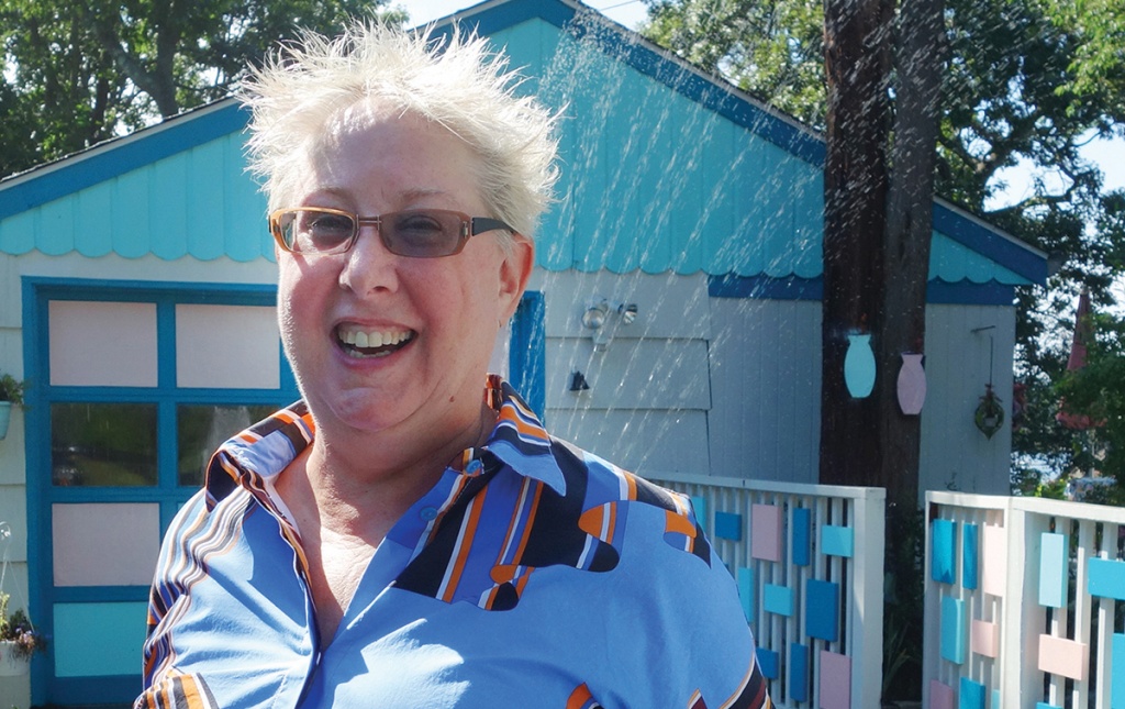 Photo of Professor Lynne Joyrich in front of her house