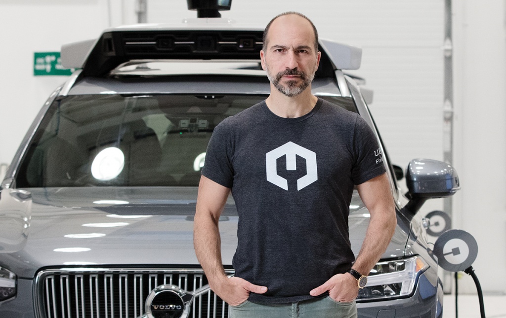 Photo of Dara Khosrowshahi in front of a self-driving car