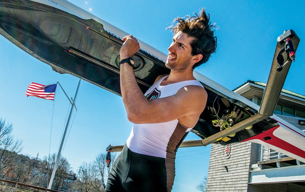 Photograph of Alex Miklasevich ’19 holding a crew boat