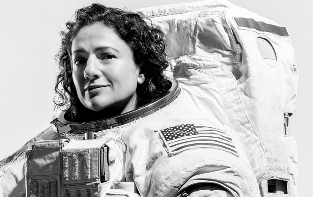 Jessica Meir ’99 poses in her spacesuit