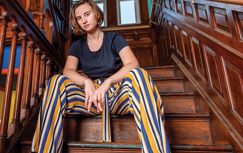 Roxanne Barnes ’21 sitting on the stairs in the Finlandia co-op