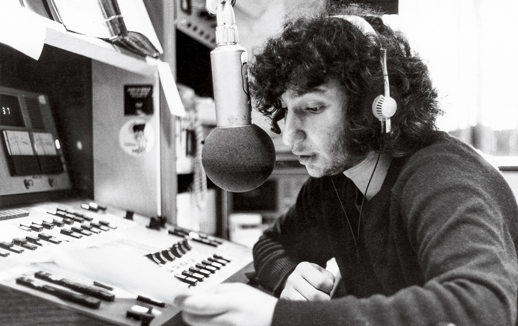 Photo of Bill Lichtenstein on the air at WBCN in 1973