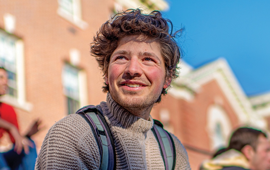 Photo of Oren Karp ’20 on steps of Robert Center