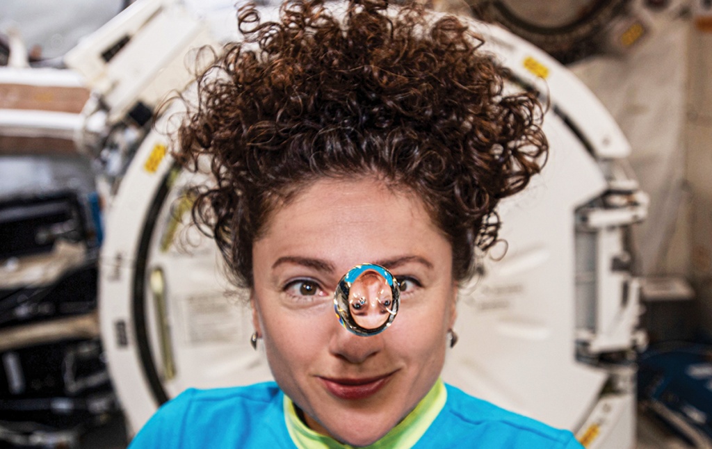 Jessica Meir ’99 plays with a water droplet in space