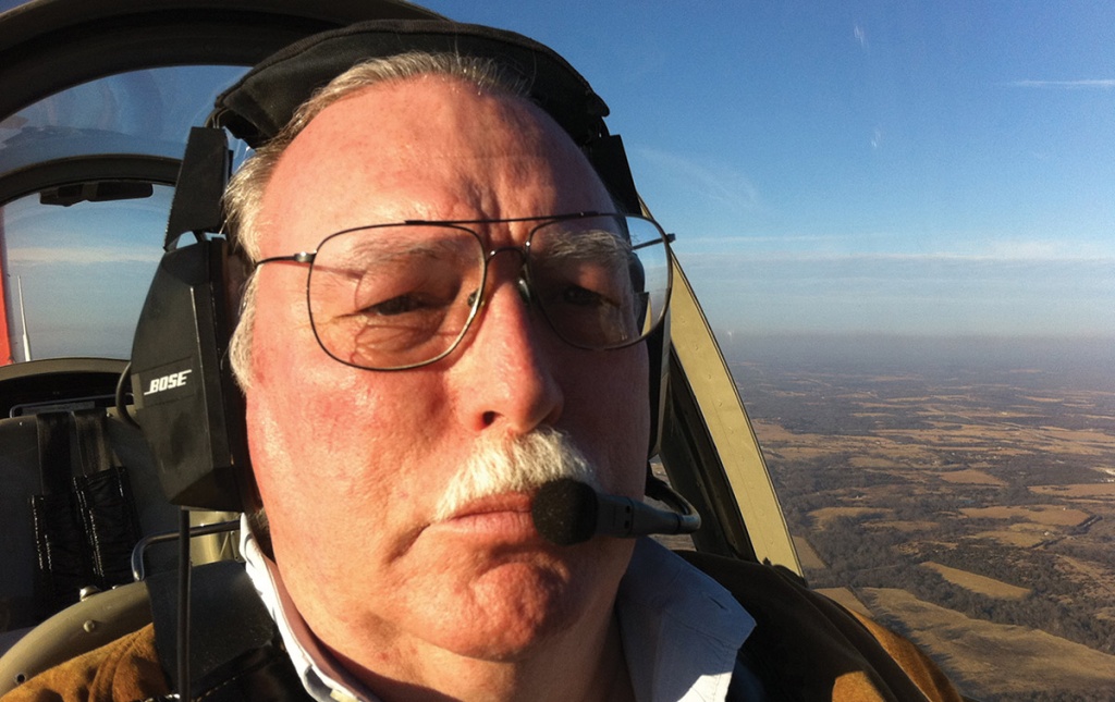 Image of George Braly flying a plane