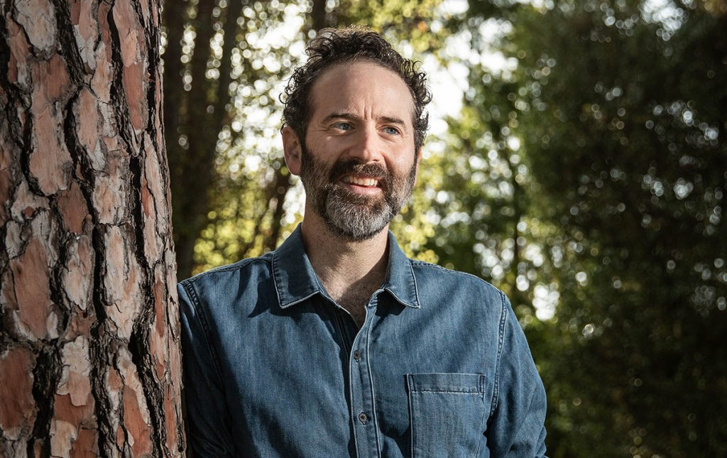 Image of Dan O'Brien leaning against a tree