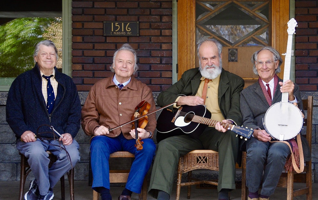 Image of the "Rhode Island Mudflaps" bandmates on a porch with instruments