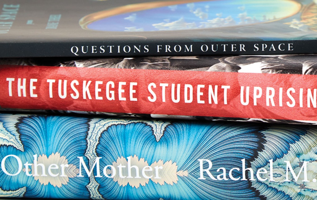 Image of the spines of books by Brian Jones ’95, Diane Thiel ’88, ’90 MFA, and Rachel M. Harper ’94