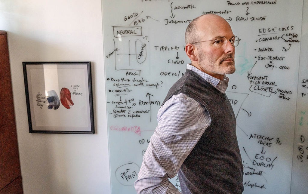 An image of Professor Jud Brewer standing in front of a white board with his hands on his hips.