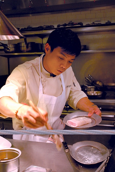 Photo of a chef preparing food.