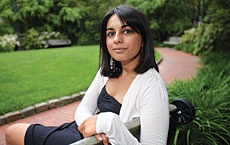 Photo of a woman sitting on a bench.