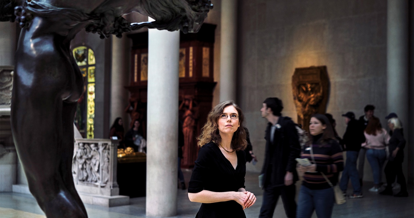 Photo of Madeline Miller, perusing antiquities at New York's Metropolitan Museum.