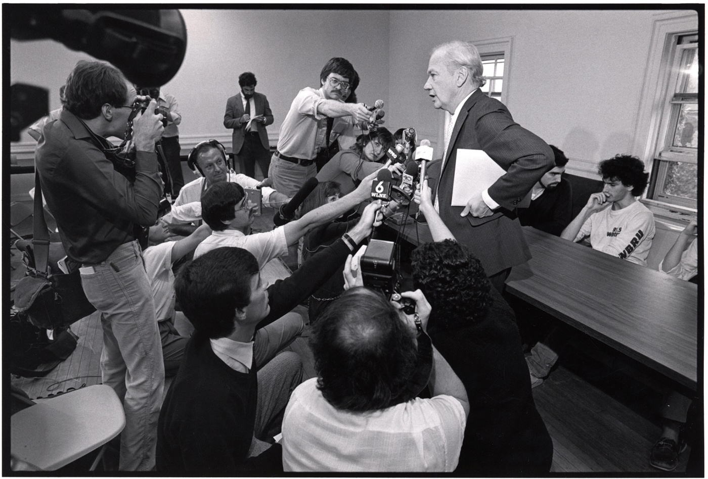 Bob Reichley surrounded by journalists