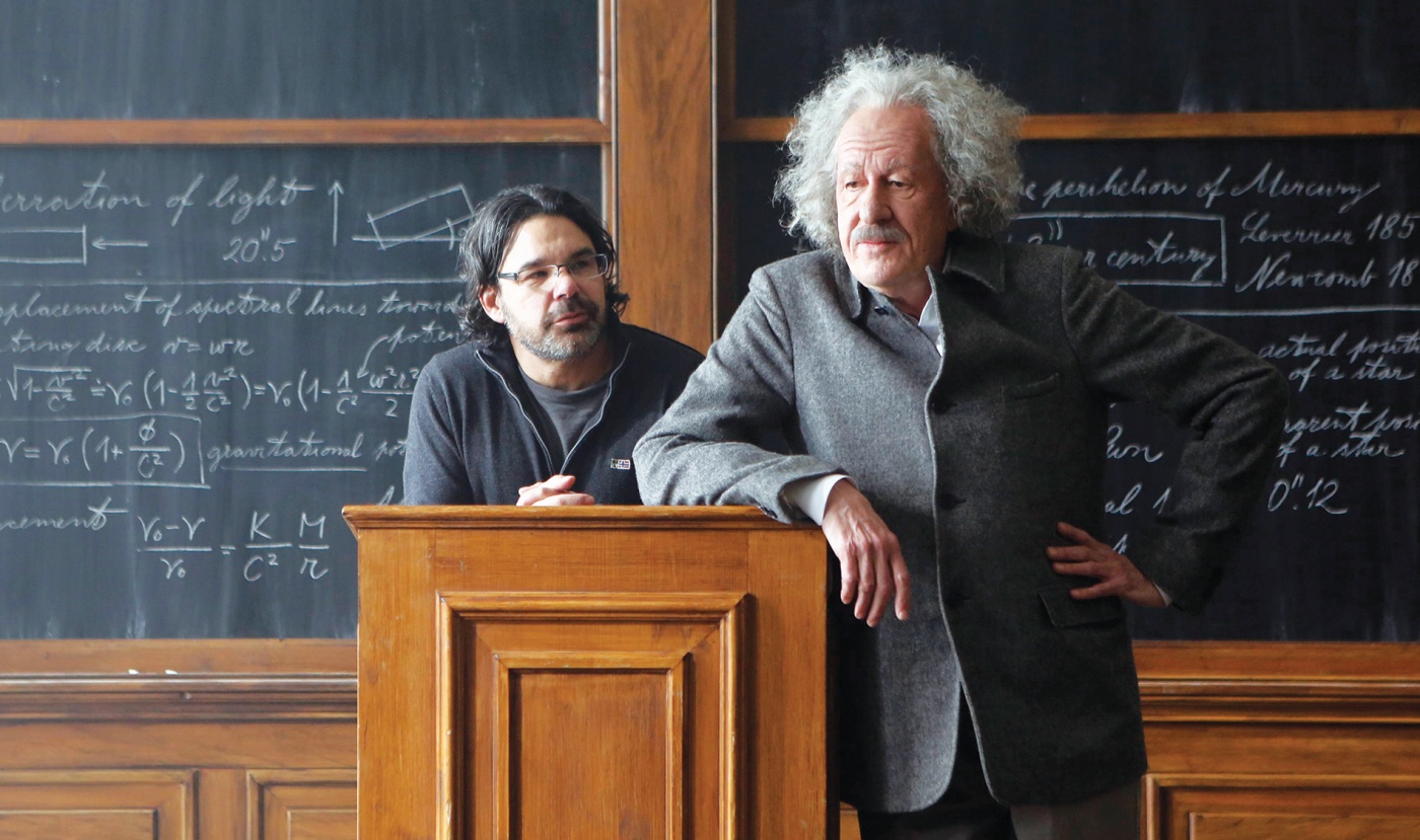 Photograph of Ken Biller ’86 with actor Geoffrey Rush (as Albert Einstein) on set