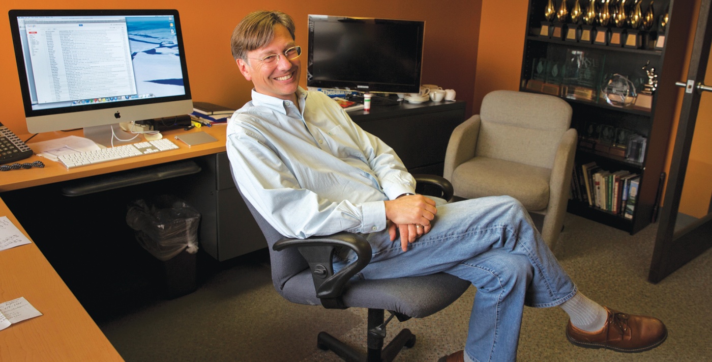 Photograph of Mark Putnam ’86 sitting at his desk