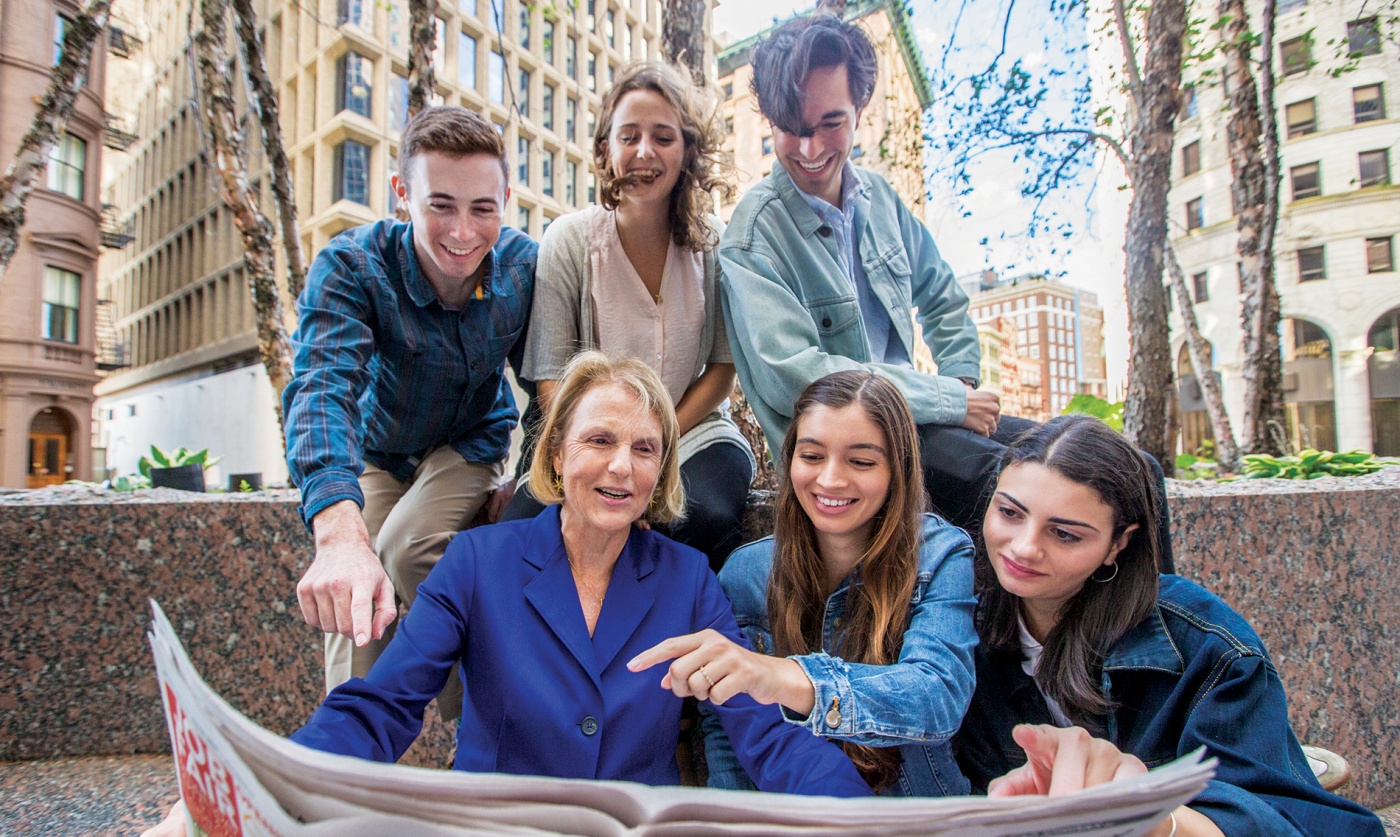 Image of journalism students and their teacher