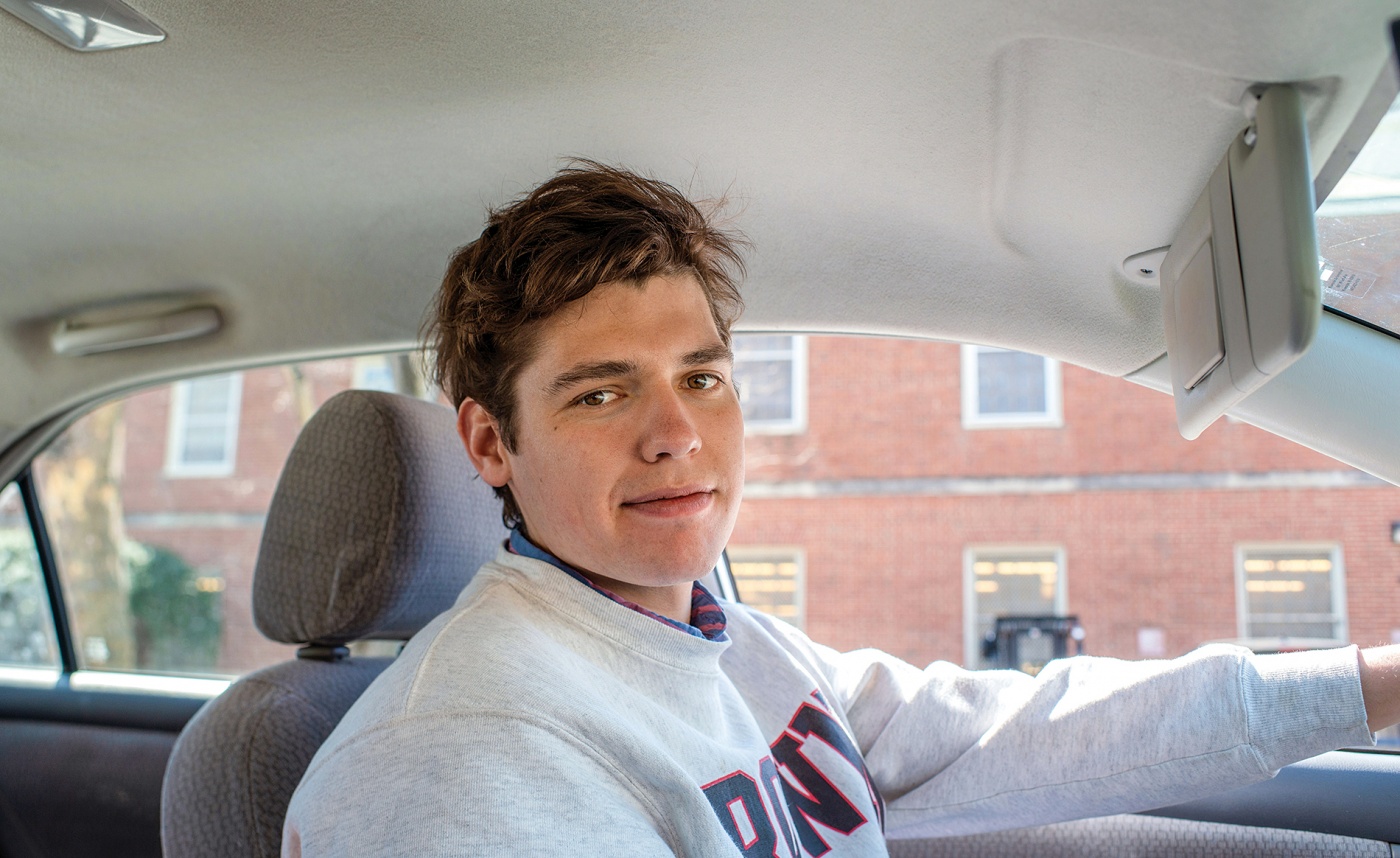 Photograph of Joey Asbel ’19 driving a car
