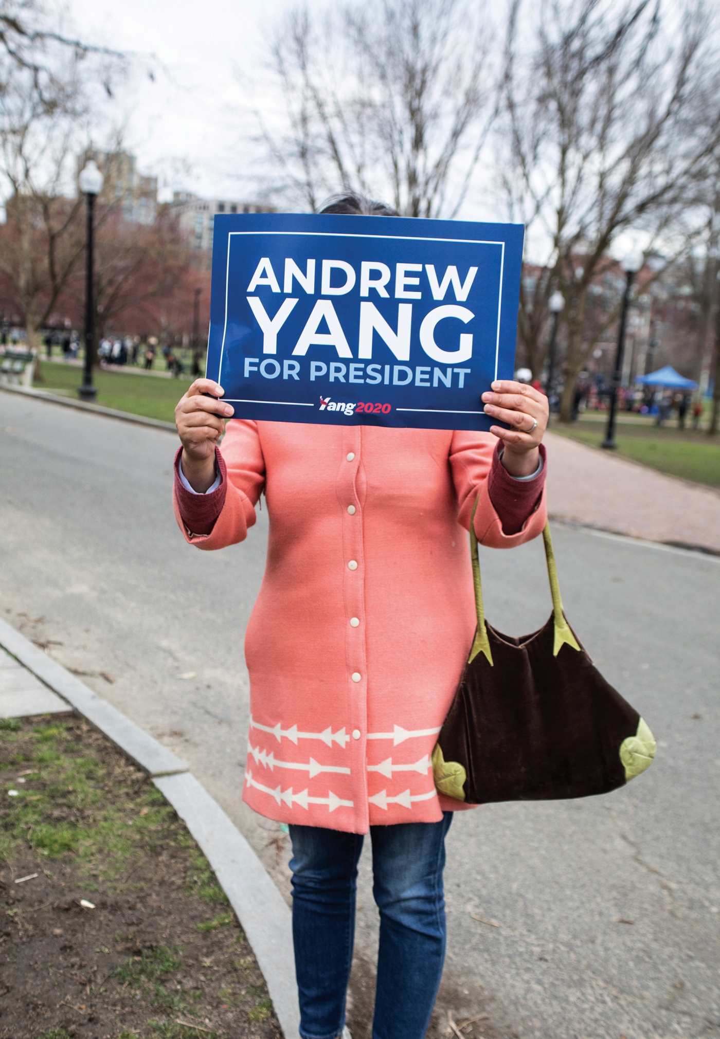 A Yang supporter holds a sign