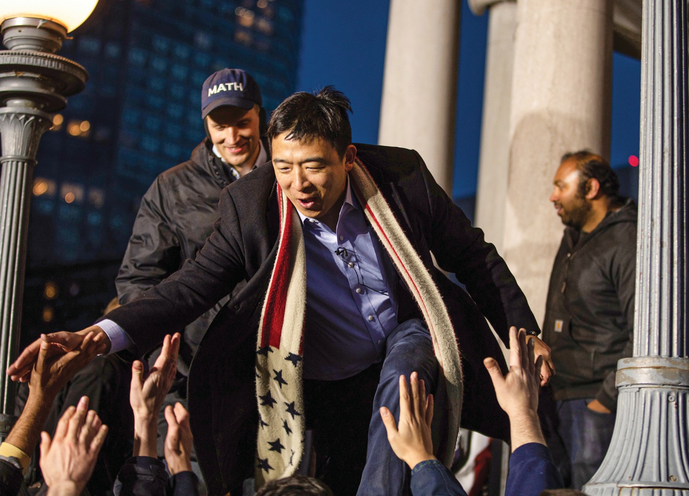 Yang hi-fives the a rally crowd