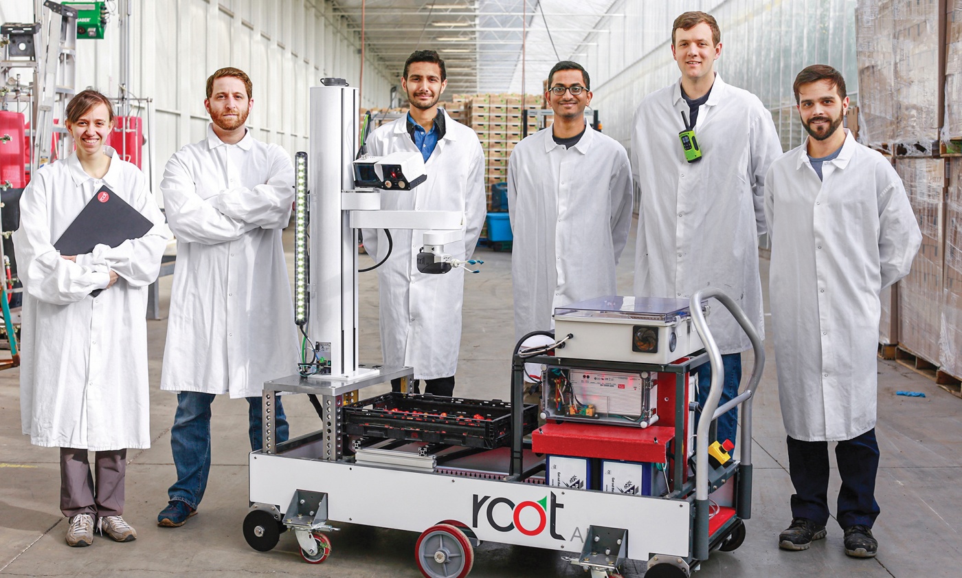 The Root AI team displays their agricultural machinery