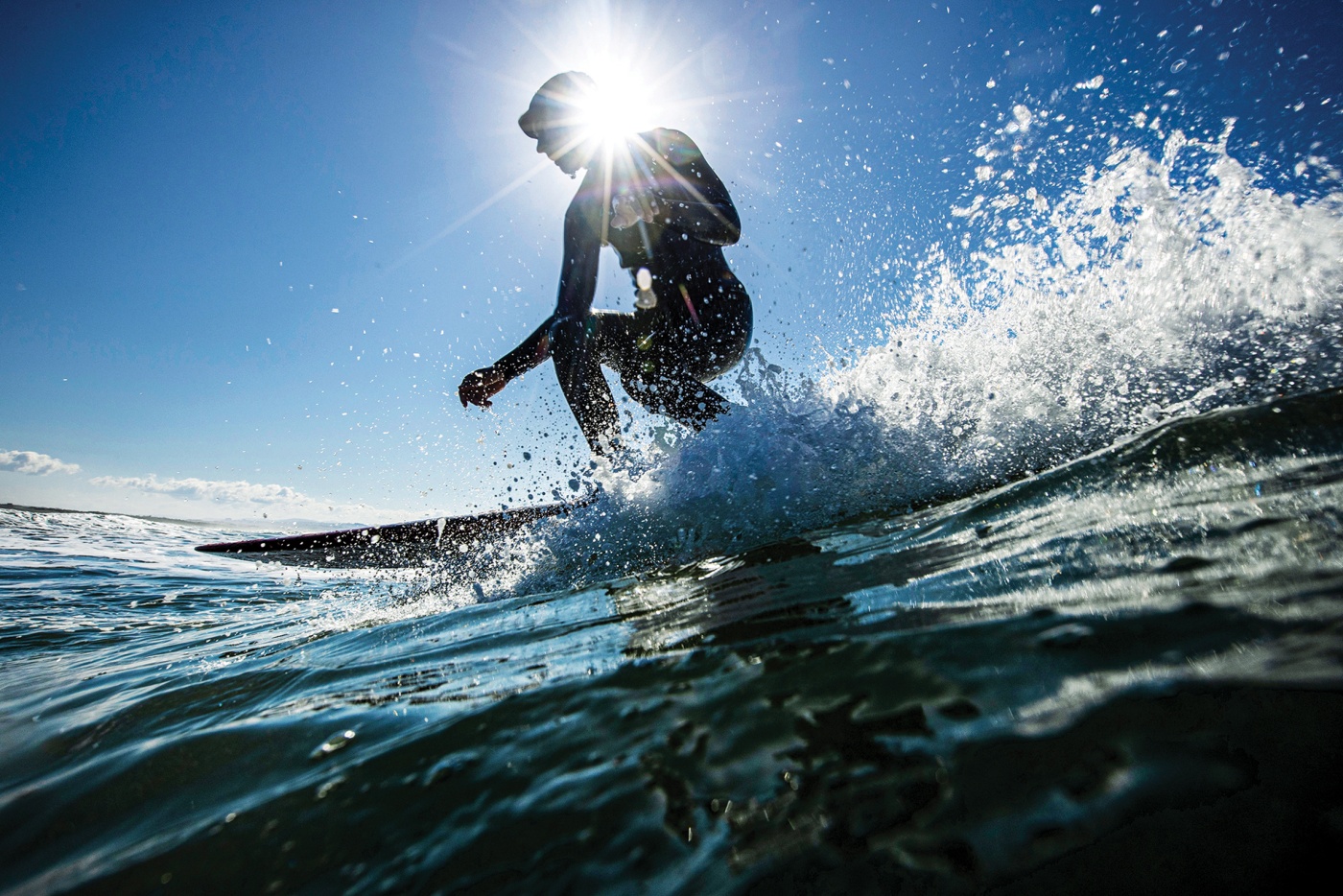 Monique Kitamura surfing