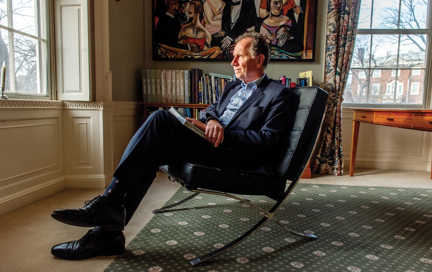 Image of Professor Dietrich Neumann sitting in a a Mies-designed “Barcelona” chair 