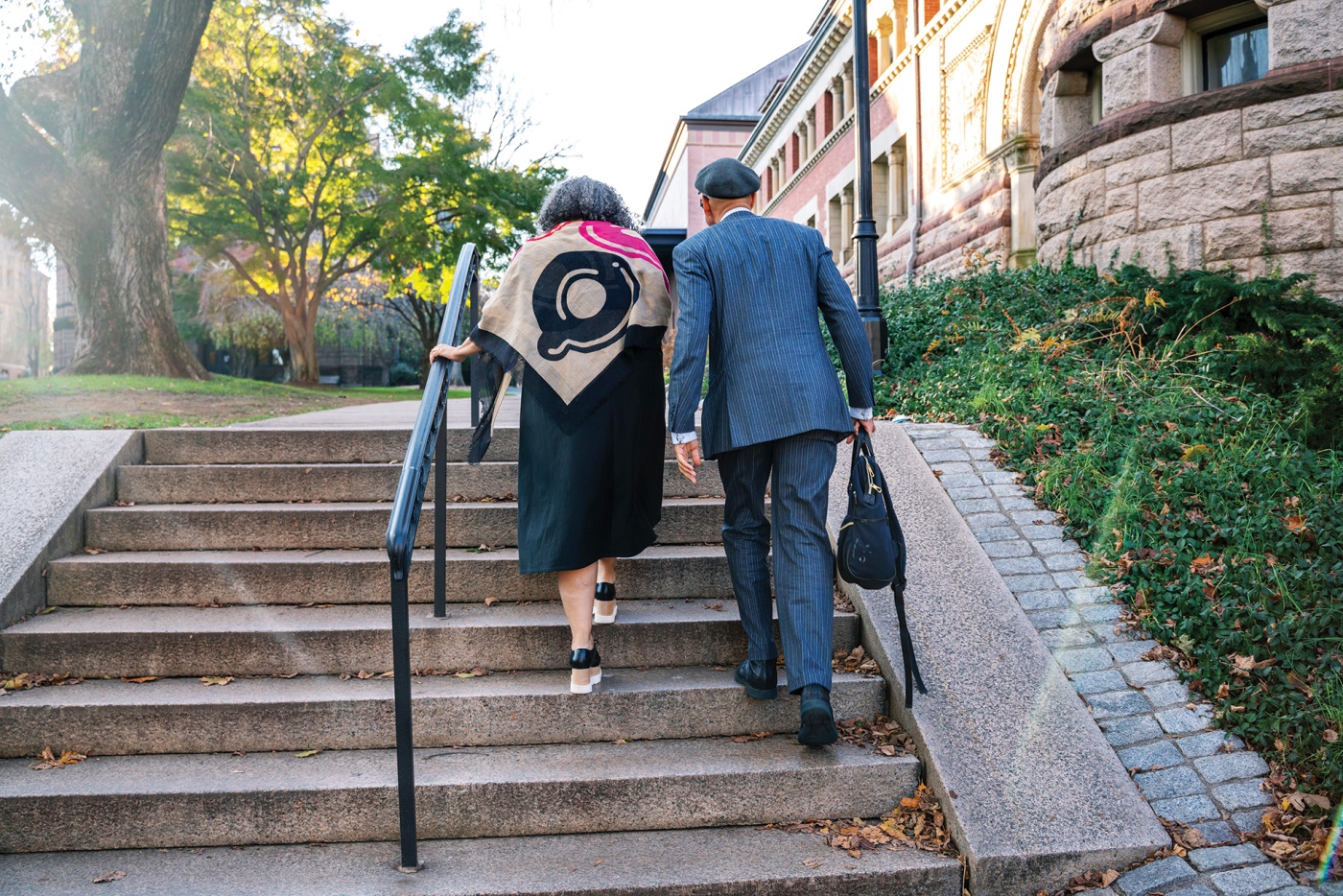 Photo of Tricia Rose and Andre Willis walking together on Simmons Quad