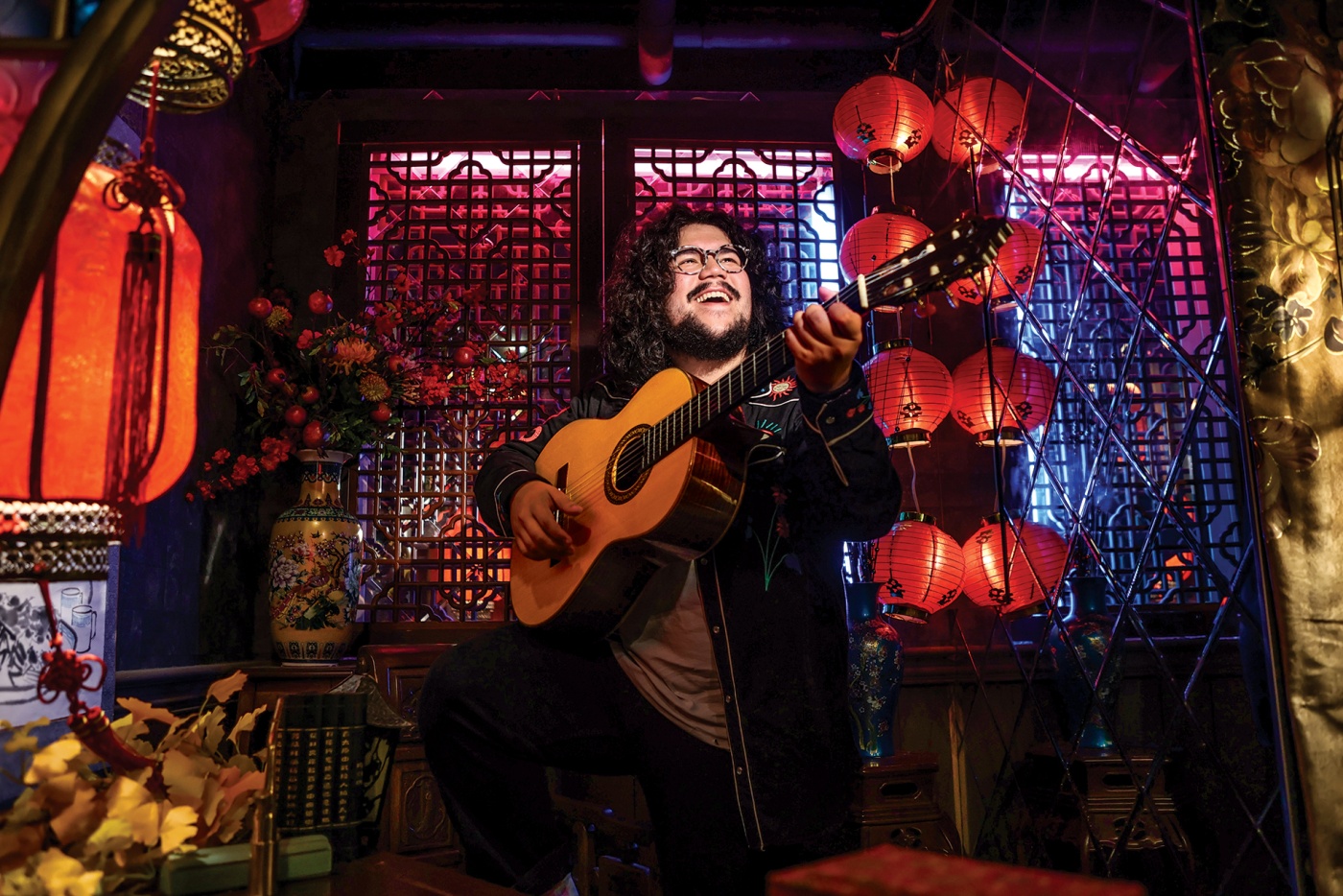 photo of Chance Emerson in a tea house, with guitar