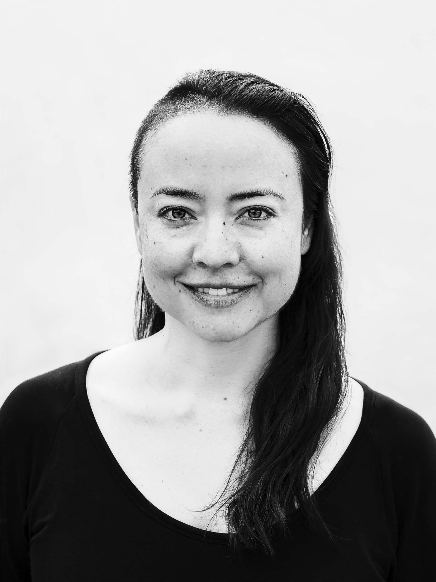 Close-up black and white image of Eirene Tran Donohue.