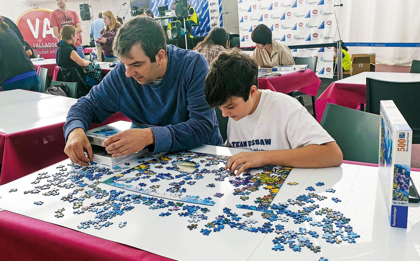 Image of A.J. Jacobs and his son working on a puzzle