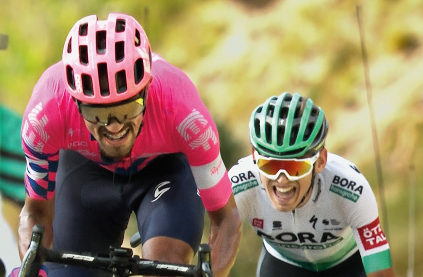 A close-up inage of two professional bicyclists racing.