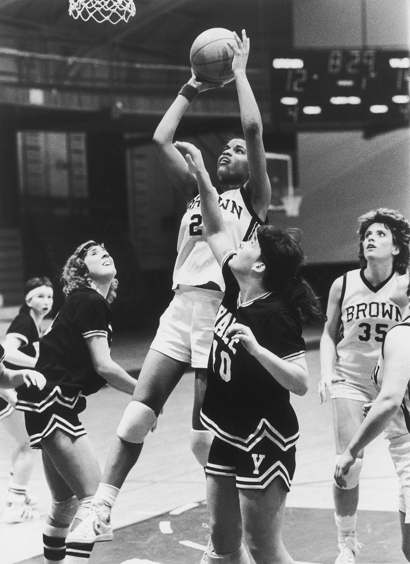 Black and white image of Michelle D. Smith shooting the basketball in a Brown game in 1984.