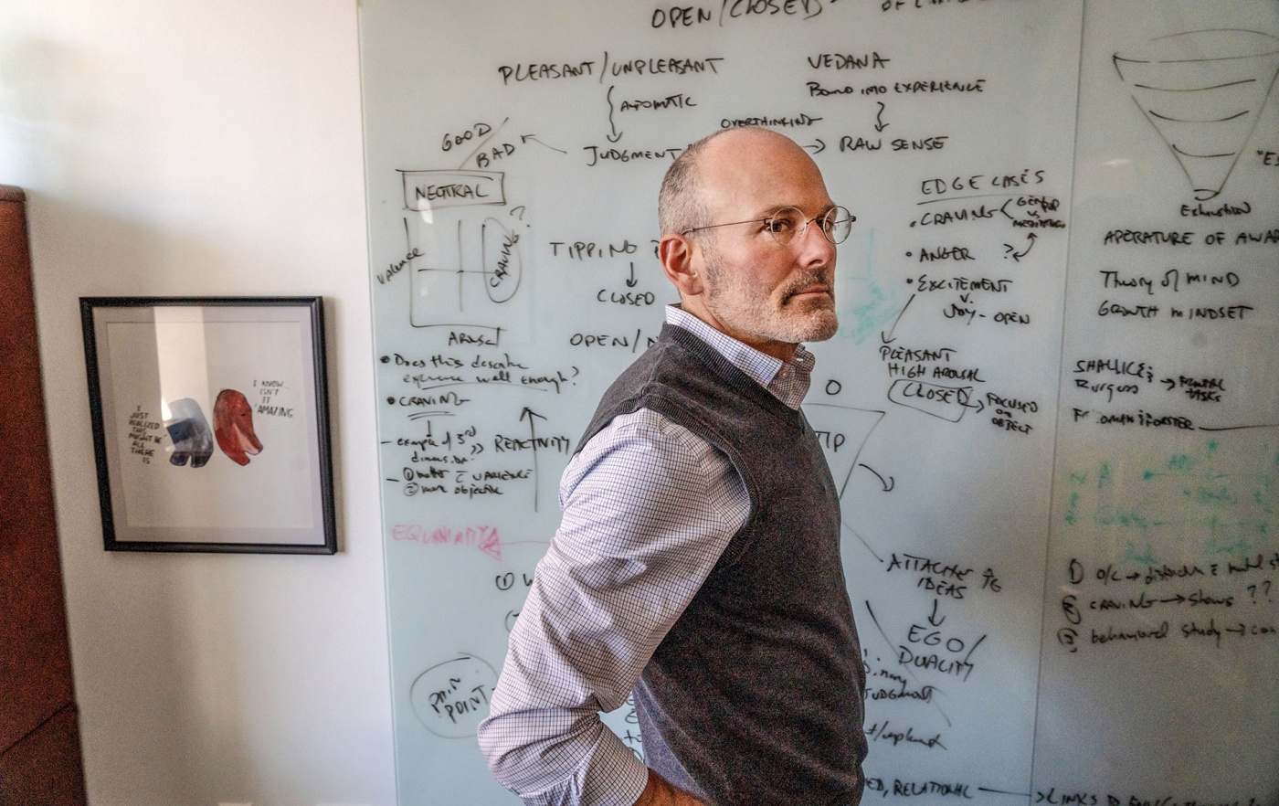 An image of Professor Jud Brewer standing in front of a white board with his hands on his hips.