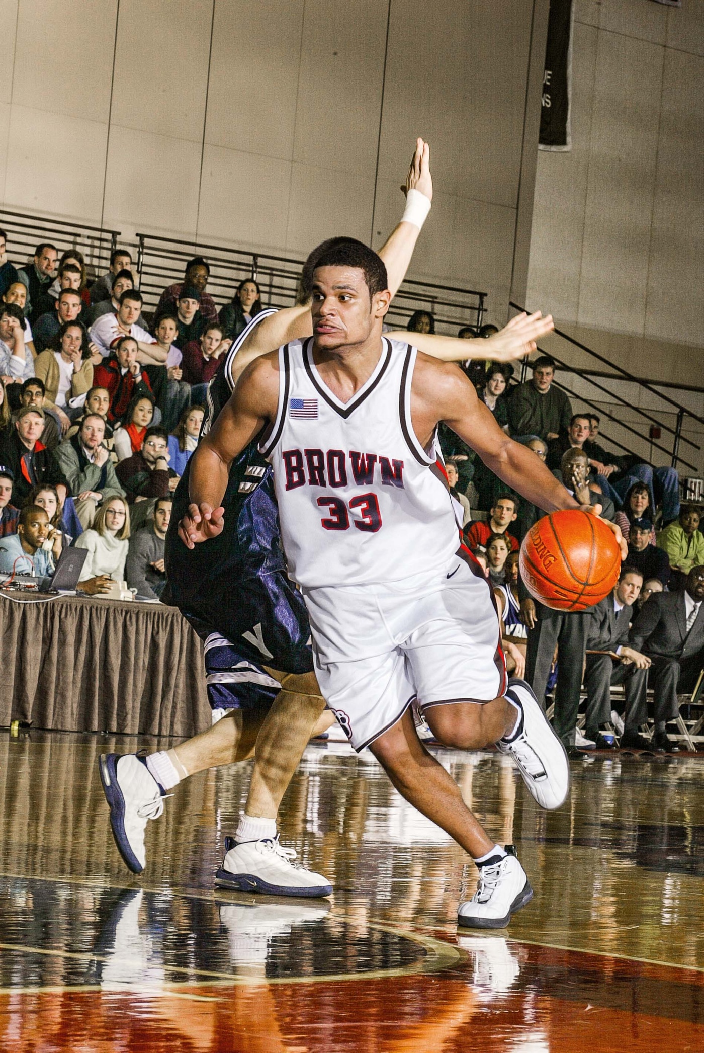 Image of Earl Hunt II dribbling the ball in a Brown basketball game
