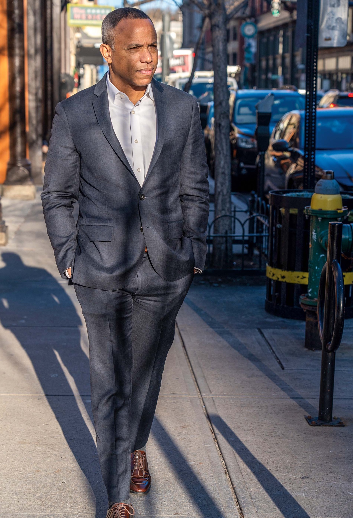 Image of Lamont Gordon walking down a city sidewalk