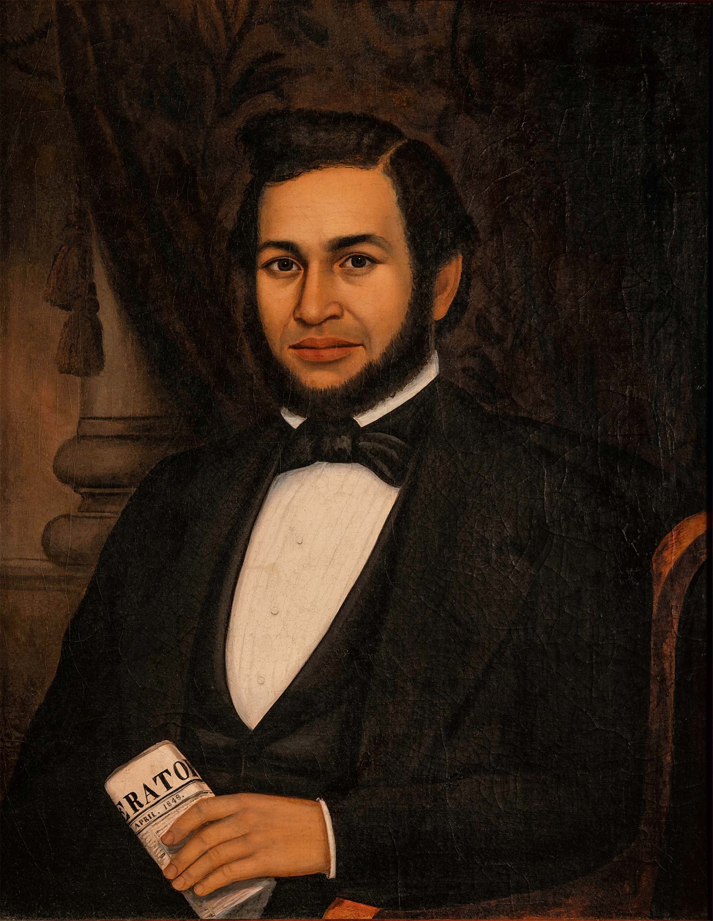 Photo of a painting of a man holding the liberator newspaper
