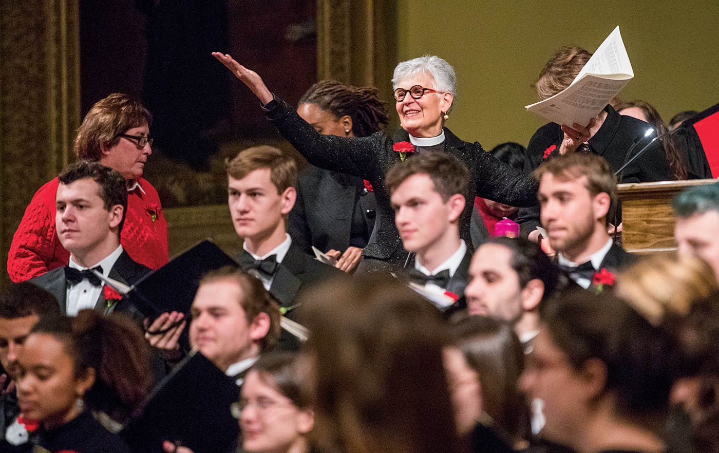 An image of Janet Cooper Nelson with students in tuxes in the foreground