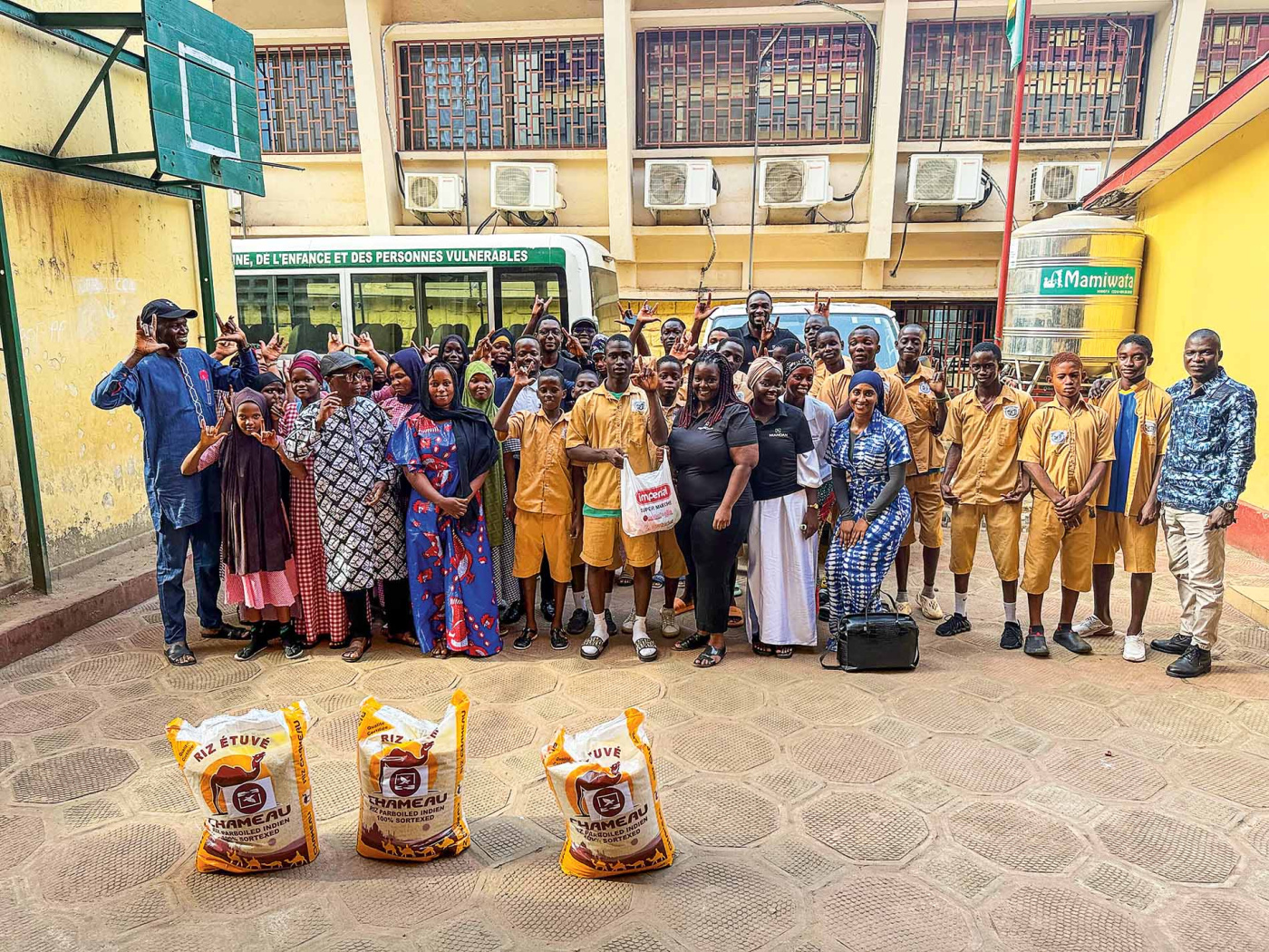Image of a group of people in a courtyard in Guinea