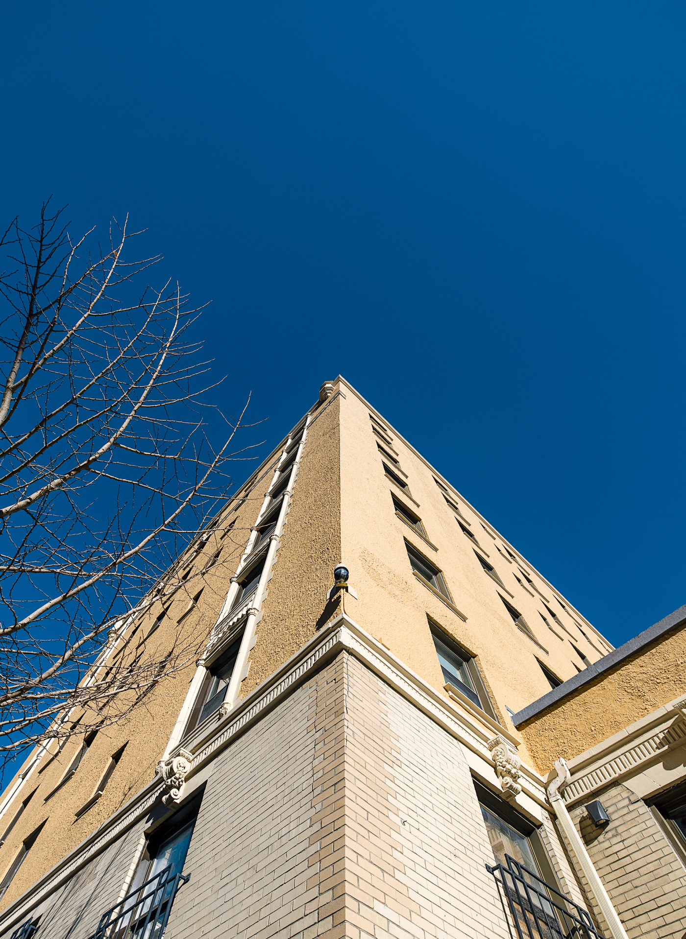 photo shows a security camera on the back of a dorm