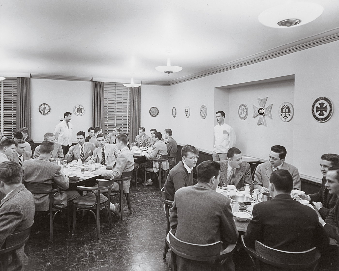 Fraternity brothers enjoy dinner in the Ratty