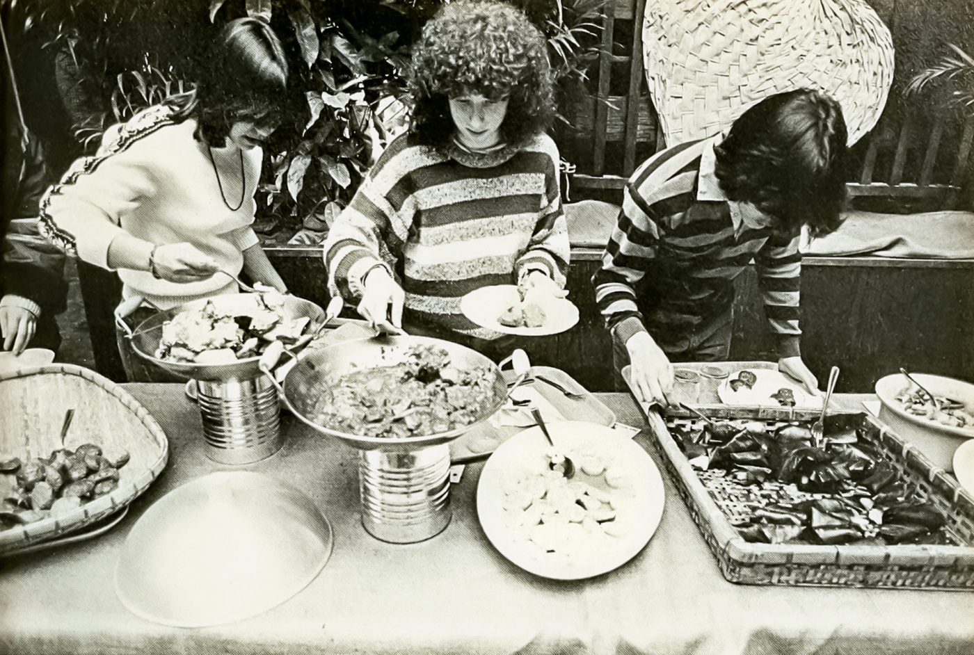 students help themselves at a buffet