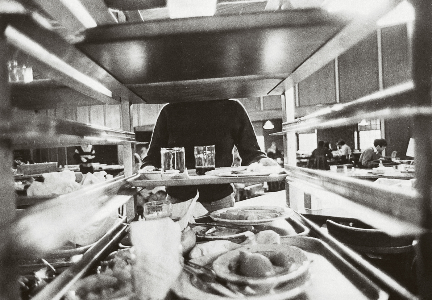 A student busses her tray at the Ratty