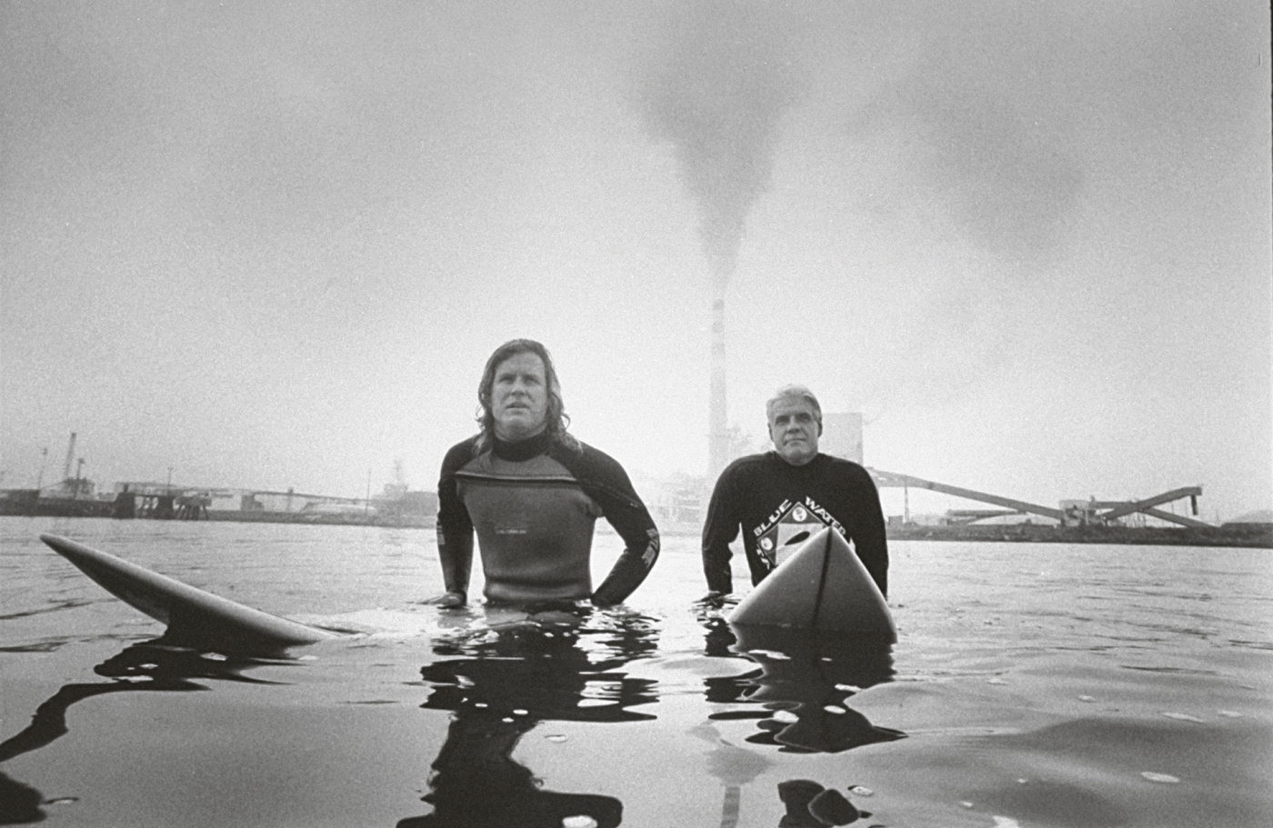 Surfers sitting on their boards