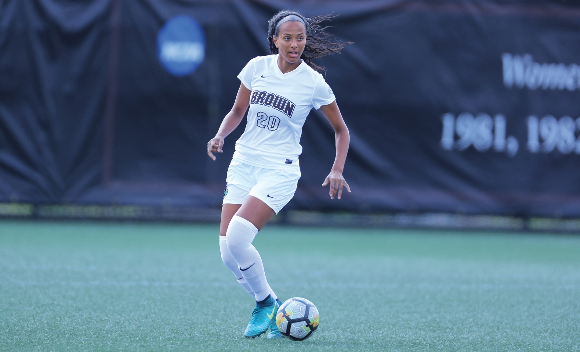 Photo of Sydney Cummings ’21 playing soccer in her Brown team uniform (number 20)