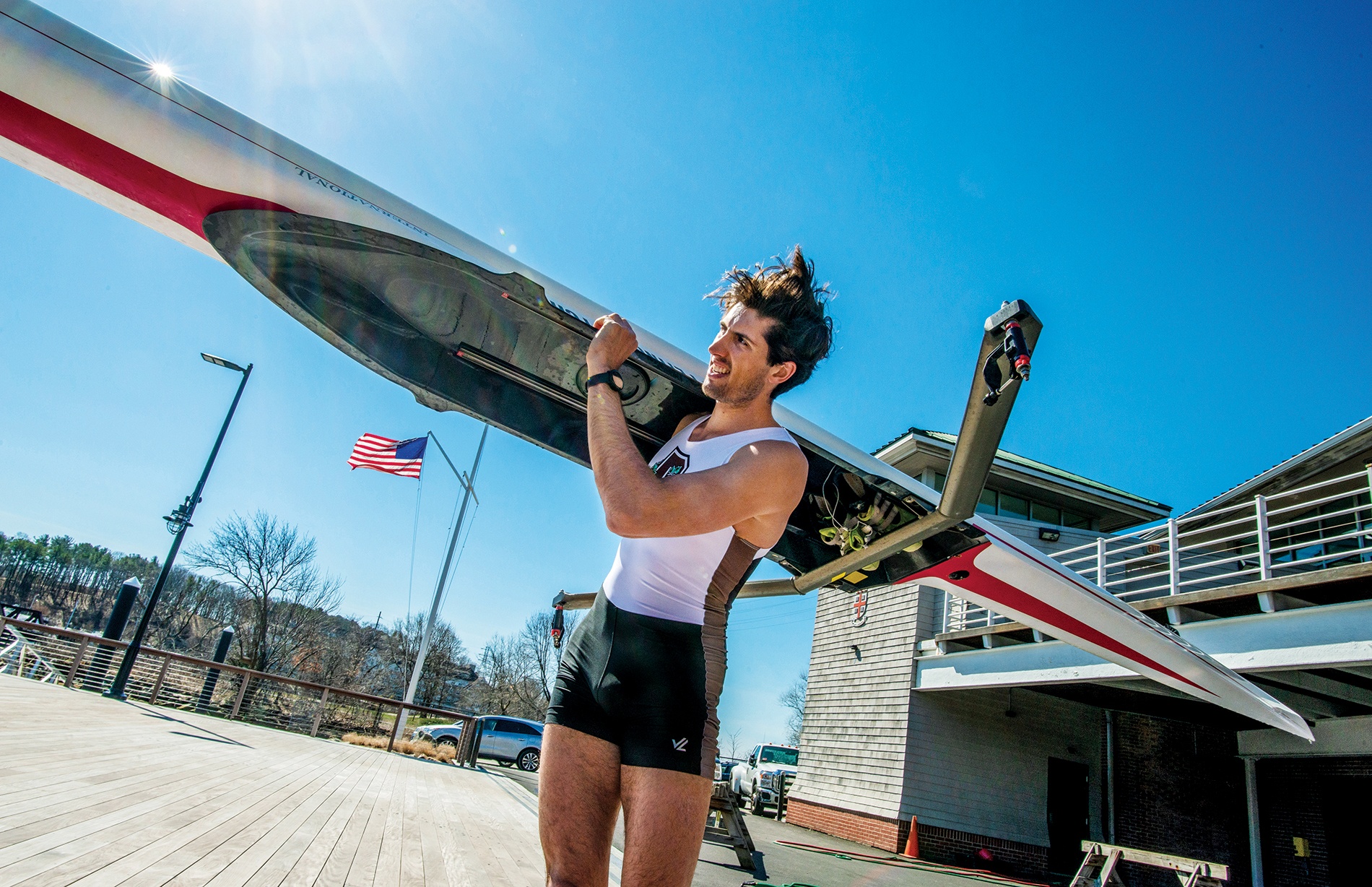 Photograph of Alex Miklasevich ’19 holding a crew boat