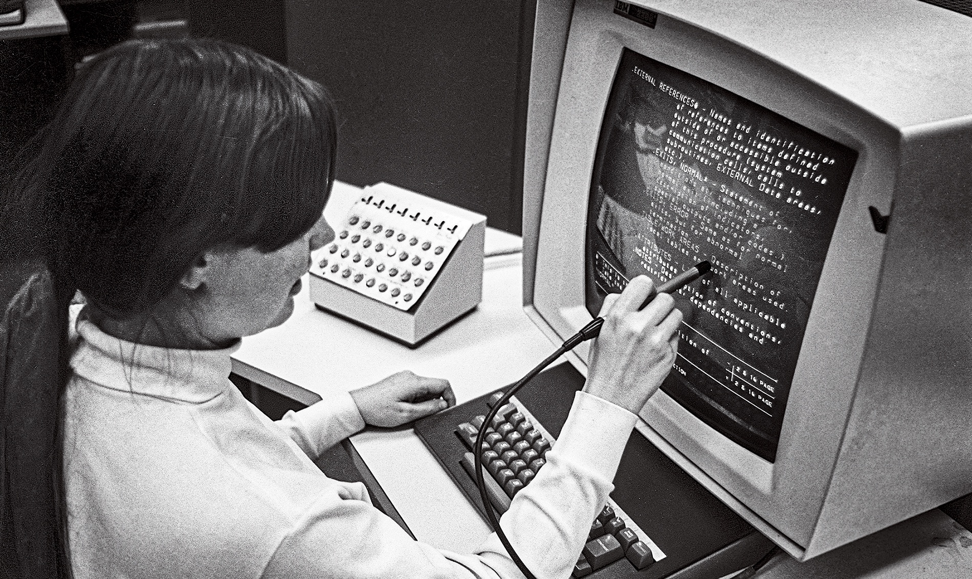 In a vintage photo, Christine Braun ’70 works with a light pen